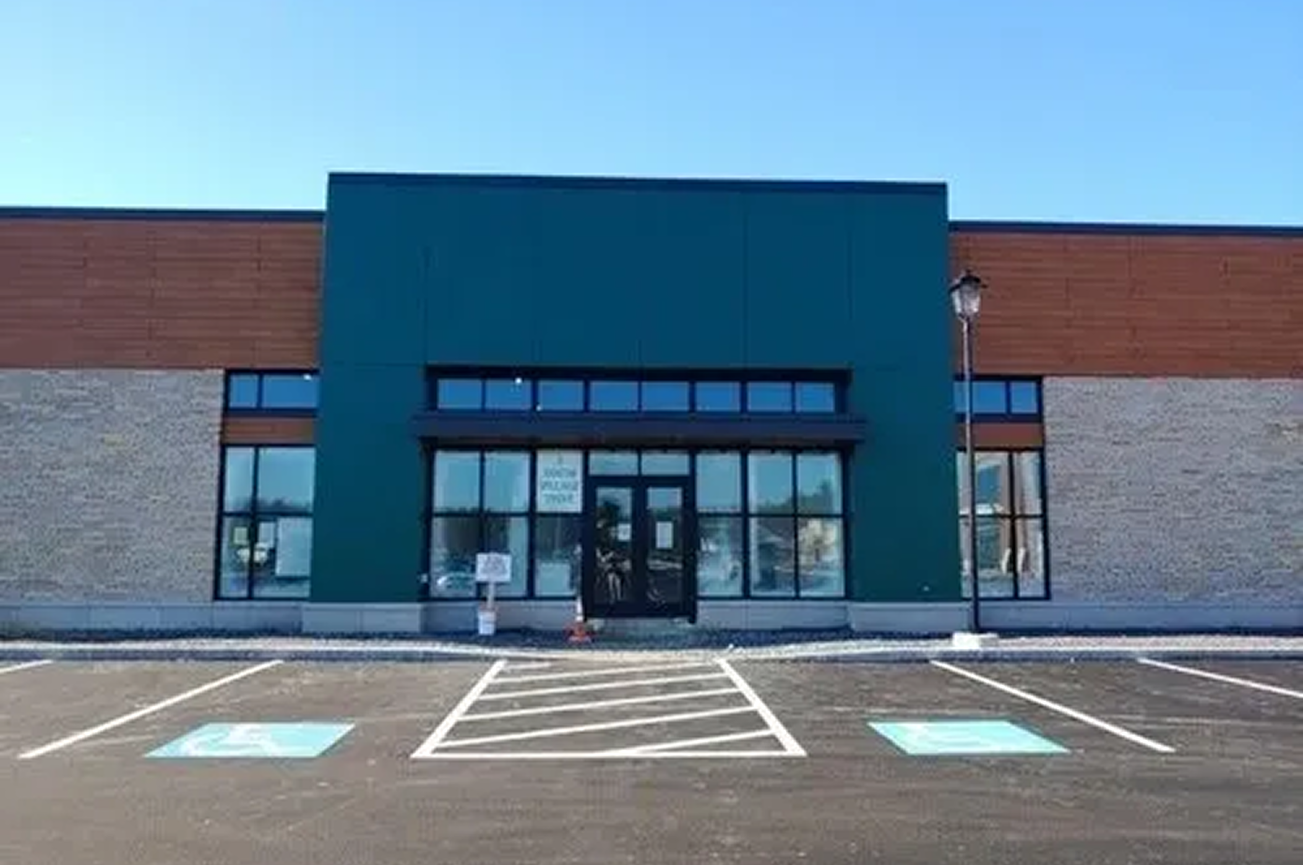 Empty storefront with parking lot